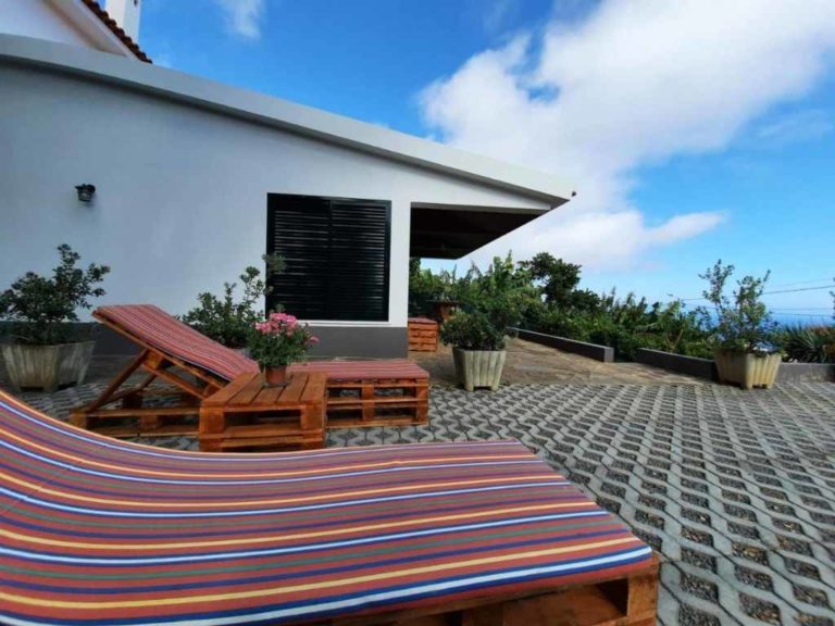 Sea view cottage sun loungers and house